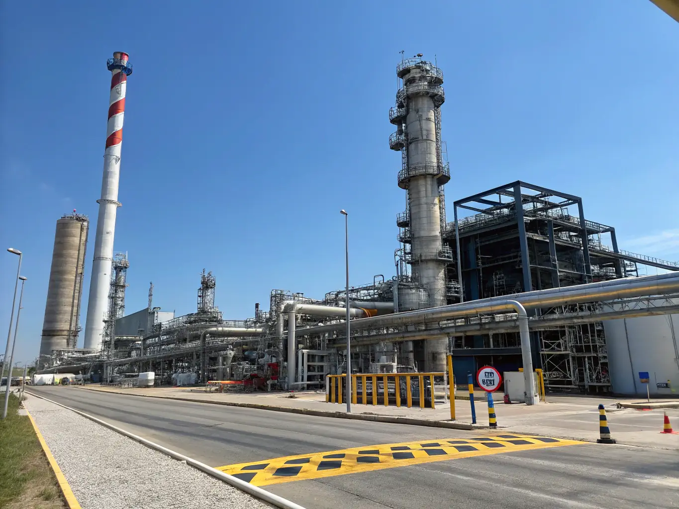 A high-resolution image depicting a chemical plant with various pipelines and valves, showcasing the application of ValvTech's valve solutions in the chemical industry. The image should convey precision and reliability.